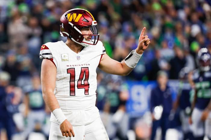Nov 12, 2023; Seattle, Washington, USA; Washington Commanders quarterback Sam Howell (14) signals to the sideline during the fourth quarter against the Seattle Seahawks at Lumen Field.